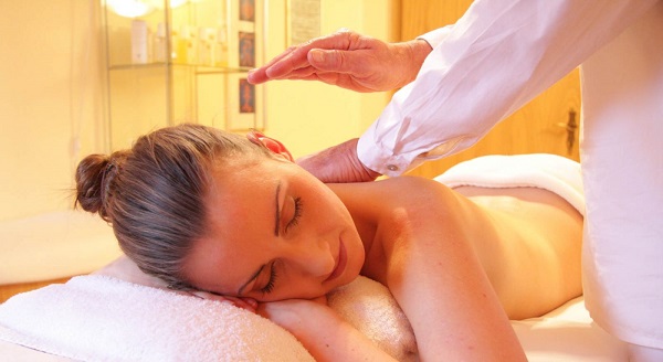 Woman Taking Massage Therapy From A Pro-Massage Therapist.